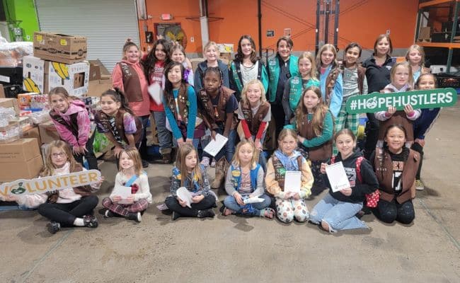 A community group visiting Second Harvest’s warehouse